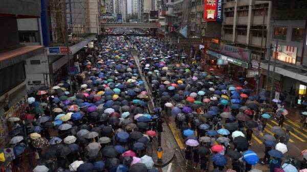 
                              Hong Kong: Violence flares again as pro-democracy protesters defy mask ban 
                      